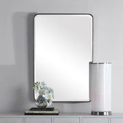 Uttermost silver wall mirror with a sleek, modern frame, perfect for contemporary home decor.