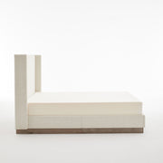 House & Home Furniture Hosford minimalist upholstered wingback bed with wood platform base, showcasing soft fabric and sleek design.