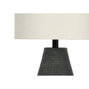 Contemporary black resin table lamp by 8th Street with a sleek modern design, ideal for living room or bedroom decor.