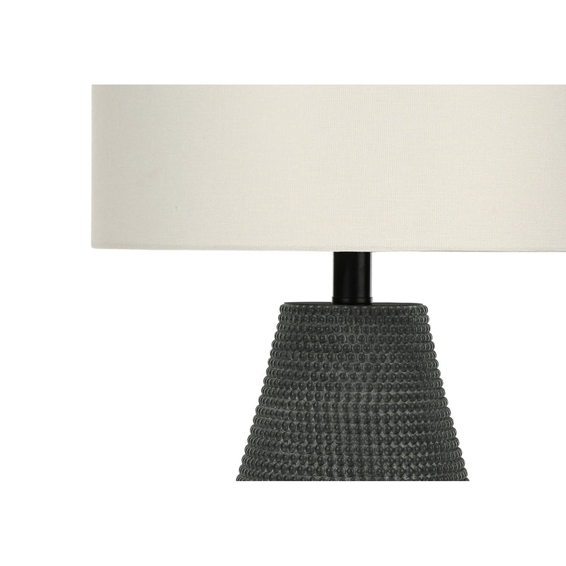 Contemporary black resin table lamp by 8th Street with a sleek modern design, ideal for living room or bedroom decor.