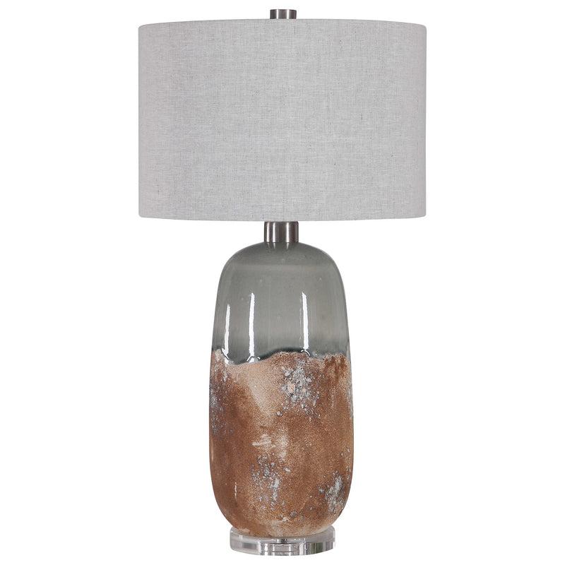 Uttermost Maggie ceramic table lamp in light brown with a rounded base and fabric shade, ideal for living room or bedside decor.