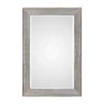 Silver metallic wall mirror with a sleek, modern frame from Uttermost Leiston collection, reflecting light and adding contemporary style.