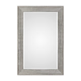 Silver metallic wall mirror with a sleek, modern frame from Uttermost Leiston collection, reflecting light and adding contemporary style.