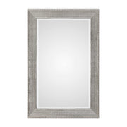 Silver metallic wall mirror with a sleek, modern frame from Uttermost Leiston collection, reflecting light and adding contemporary style.