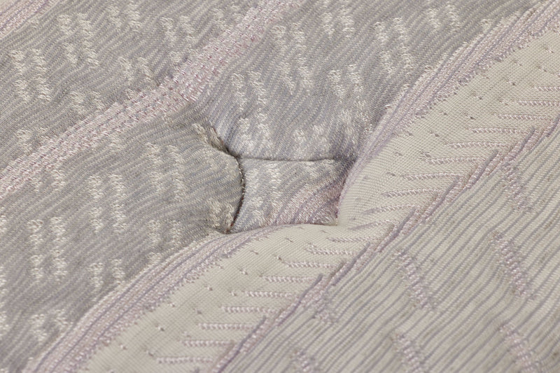 Restonic ComfortCare Hybrid CosmoRest Euro Top mattress showing plush fabric cover and plush Euro top design on a bed.