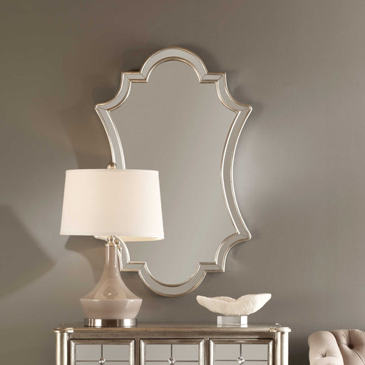 Elara wall mirror by Uttermost with antiqued silver finish, featuring a round frame and vintage-inspired design.