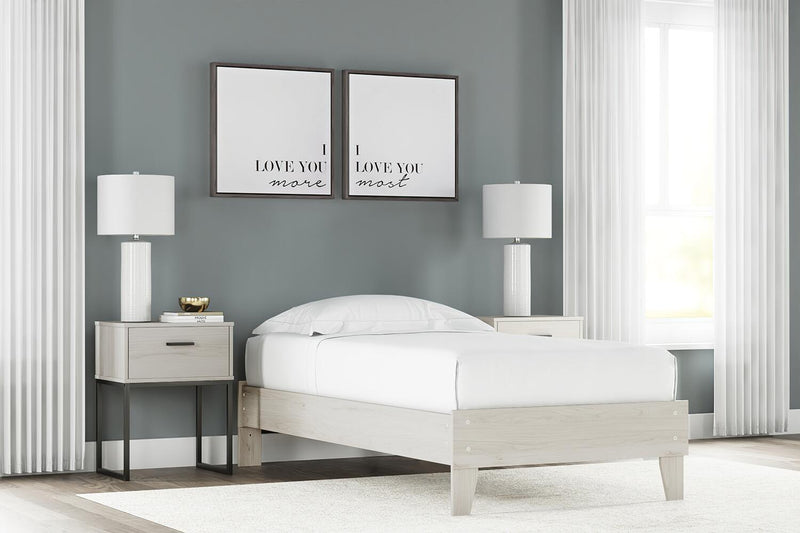 Signature Design by Ashley Socalle platform bed with a modern wooden frame and clean lines in a bedroom setting.