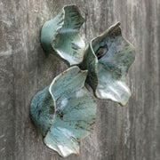 Set of three Uttermost Teo wall decor pieces featuring modern geometric designs in neutral tones displayed on a wall.