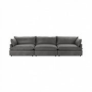 Classic Home Caplan modular sectional in neutral fabric, showcasing its spacious, stylish stationary design with plush cushions.