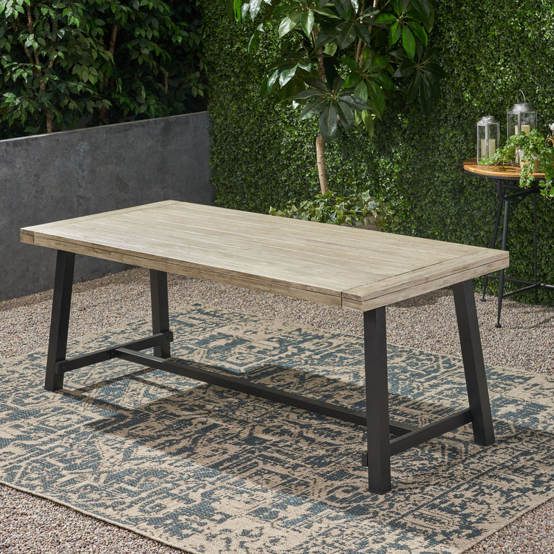 Noble House Equilibrium outdoor dining table with wooden frame and slat top, perfect for outdoor patio or garden dining spaces.