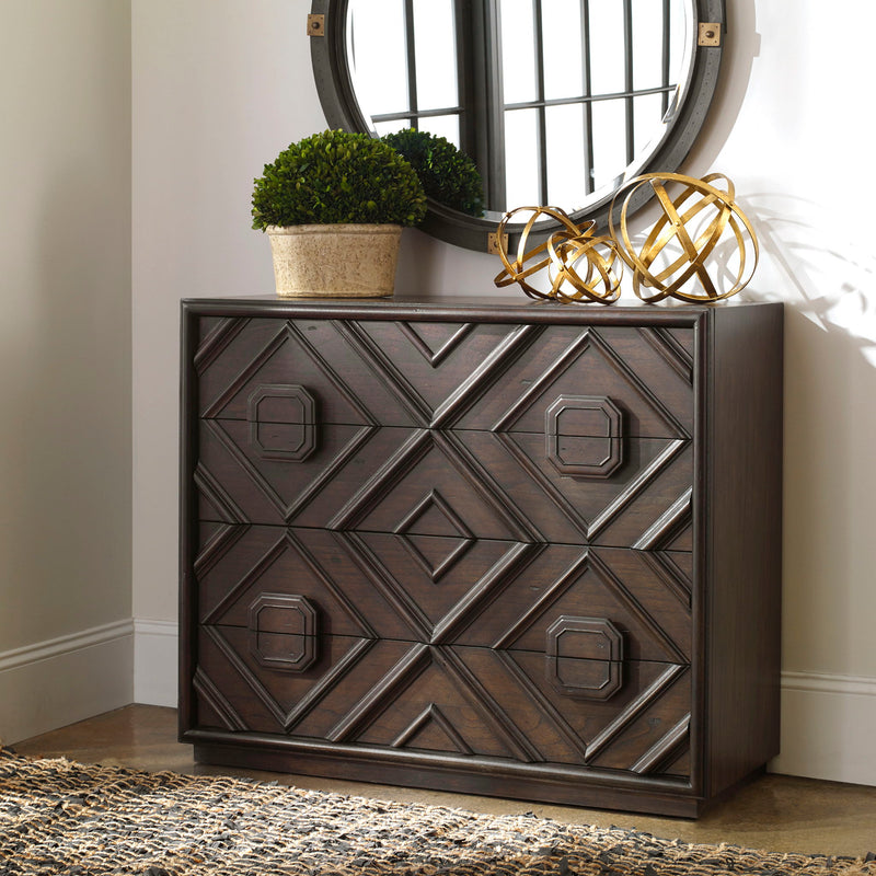 Dark brown Uttermost Mindra drawer chest, accent storage piece with sleek design and multiple drawers, placed in a modern interior setting.