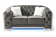 Glory Furniture stationary loveseat with flared arms, upholstered in neutral fabric, placed in a modern living room setting.