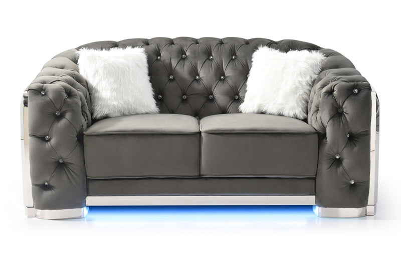 Glory Furniture stationary loveseat with flared arms, upholstered in neutral fabric, placed in a modern living room setting.