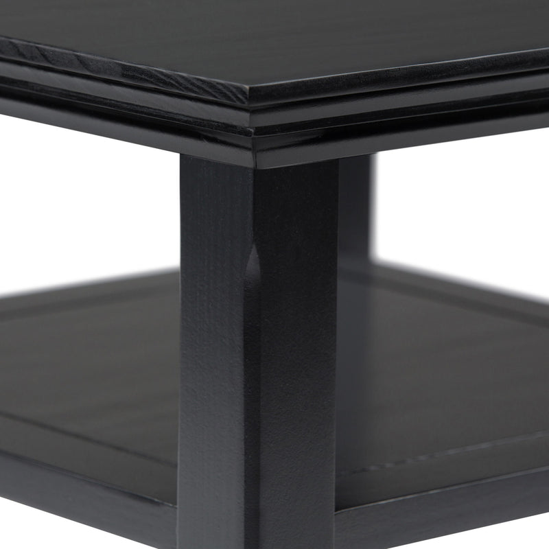Handcrafted Acadian end table by Simpli-Home featuring a wooden surface and tapered legs, ideal for living room or bedroom decor.