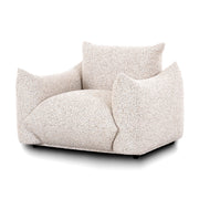 TOV Furniture Saint Tropez Nubby Fabric Armchair in sand color, showcasing its cozy, textured upholstery and modern design.