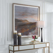 Framed print titled "Dawn On The Hills" by Uttermost, featuring a purple landscape scene with a decorative frame.