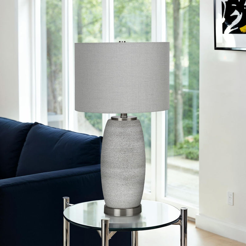 Gray ceramic table lamp from 8th Street featuring a modern design, ideal for living rooms or bedrooms.