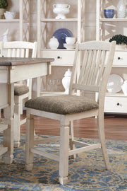 Set of two beige upholstered barstools by Signature Design Ashley, showing padded seats and wooden legs.