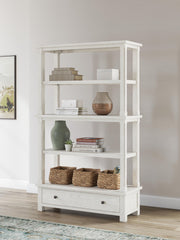 Robbinsdale antique white standard bookcase by Signature Design Ashley with multiple shelves and open storage space.