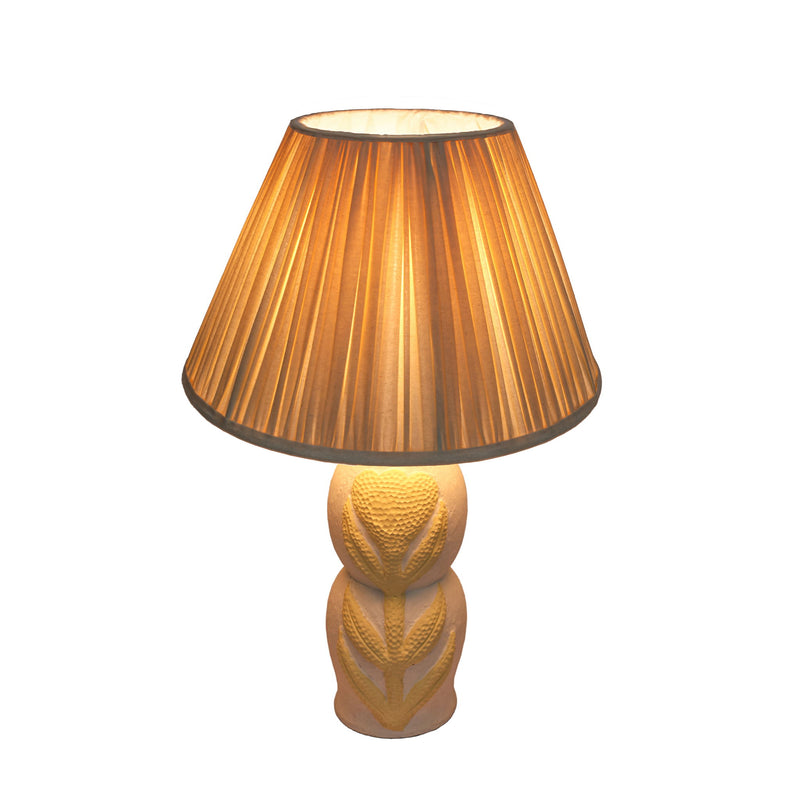 Cream Edith TOV Furniture curved papier mache flower pleated table lamp with textured floral design and modern aesthetic.