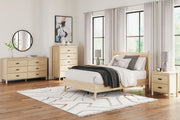 Signature Design by Ashley Cabinella platform bedroom set with a bed, nightstands, and dresser in a modern, stylish bedroom scene.
