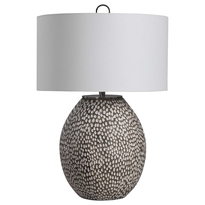 Uttermost Cyprien gray and white table lamp with a sleek modern design, featuring a cylindrical base and fabric shade.