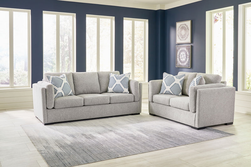 Benchcraft Evansley living room set featuring a stationary chair and matching ottoman with plush upholstery and stylish design.
