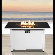 White outdoor rectangular fire pit table with adjustable flame control, 43 inches long by LSI Patio Furniture, surrounded by outdoor seating.