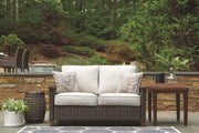 Paradise Trail - Loveseat w/Cushion - Medium Brown - R&R Furniture Gallery (Fountain Valley, CA)
