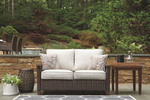 Paradise Trail - Loveseat w/Cushion - Medium Brown - R&R Furniture Gallery (Fountain Valley, CA)