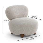 TOV Furniture Pucker Accent Armless Chair in warm gray fabric, showcasing a sleek, modern design with plush cushioning.