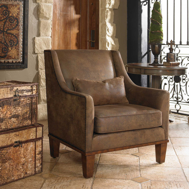 Dark brown leather armchair from Uttermost featuring a classic leather armchair design with plush cushioning.