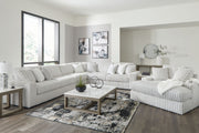 Signature Design by Ashley 5-piece living room set featuring a sofa, loveseat, armchair, and matching coffee table in a modern style.