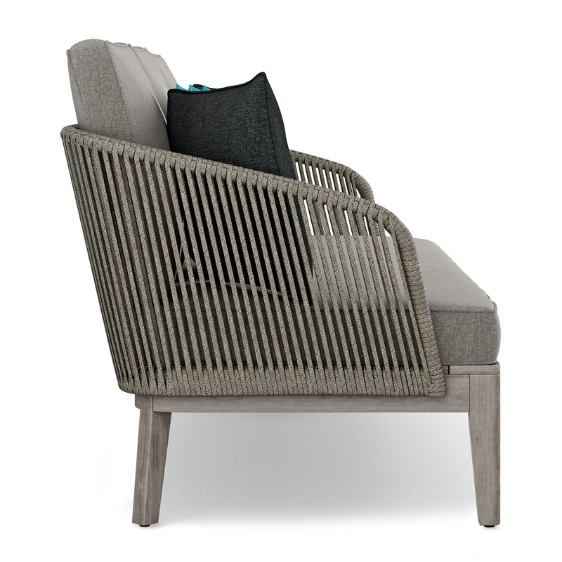 Simpli-Home Carmel outdoor sofa in Sand Drift color with plush cushions, designed for comfortable outdoor seating.
