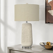 Cream ceramic and resin table lamp by 8th Street, contemporary design with a smooth, rounded shape for modern home decor.