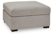 Benchcraft ModMax Luxe oversized accent ottoman in Flint fabric, showing its plush, contemporary design and sturdy construction.