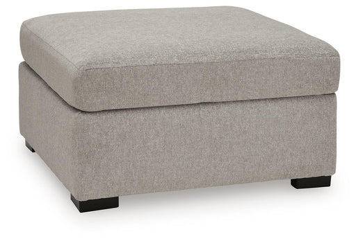 Benchcraft ModMax Luxe oversized accent ottoman in Flint fabric, showing its plush, contemporary design and sturdy construction.