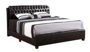 Dark brown upholstered King bed by Glory Furniture with a plush headboard and sleek wooden frame.