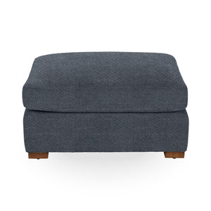 Classic Home Audrey upholstered ottoman with cushioned top and wooden legs, versatile for living room or bedroom décor.