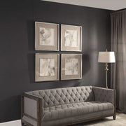 Set of four beige framed abstract art prints by Uttermost, featuring modern divination-inspired designs for wall decor.