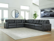 Signature Design by Ashley Brindley Pier stationary sectional sofa with plush cushions and modern design in a living room setting.