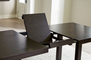 Neymorton - Rectangular Dining Room Butterfly Extension Table - Dark Grayish Brown - R&R Furniture Gallery (Fountain Valley, CA)
