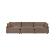 Classic Home Caplan modular sectional sofa with beige fabric upholstery and plush cushions, designed for comfortable seating.