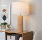 Contemporary Ash and antique brass cylinder table lamp by Lumi Source with white shade on a sleek base.