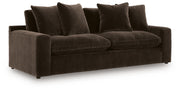 Benchcraft® Maxton Heights stationary sofa with plush cushions and modern design, featuring neutral fabric upholstery.