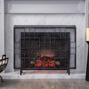 Modern single-panel iron fireplace screen with intricate design, by Noble House, designed to protect and decorate a fireplace area.