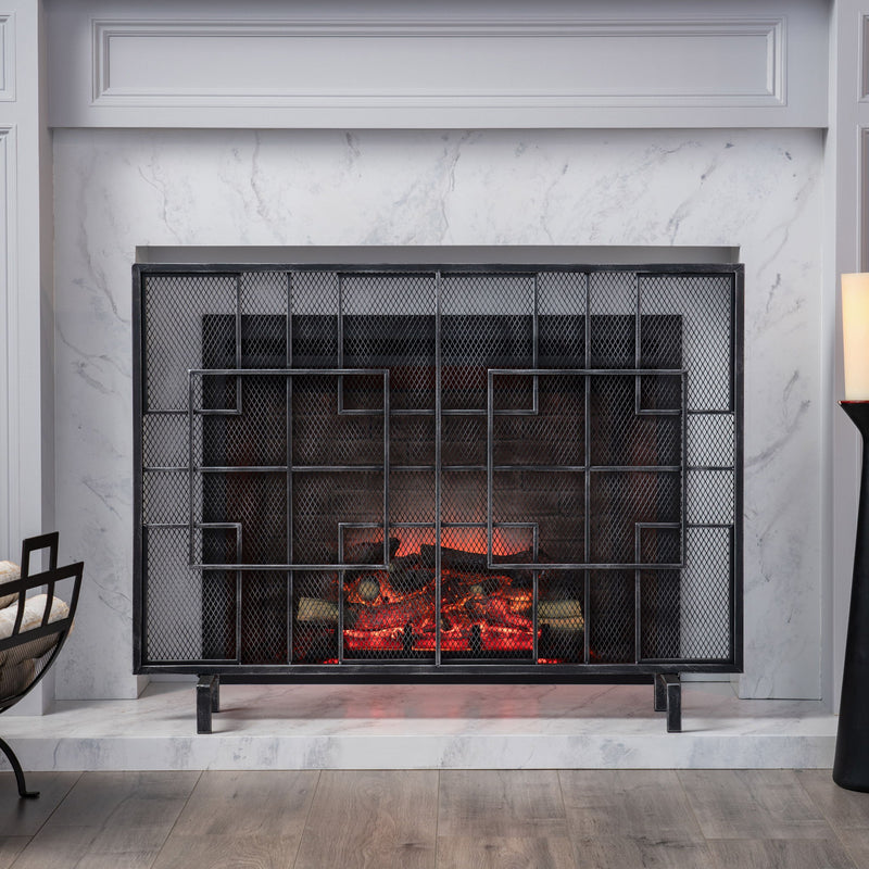 Modern single-panel iron fireplace screen with intricate design, by Noble House, designed to protect and decorate a fireplace area.