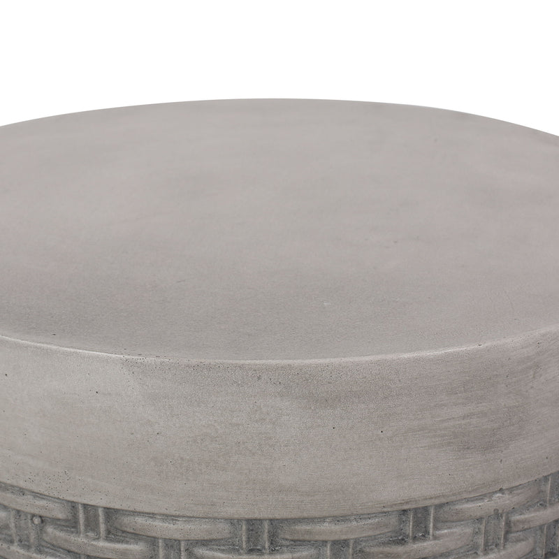 Round concrete outdoor end table from Noble House, lightweight natural finish, perfect for patio or garden seating areas.