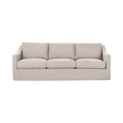Classic Home Kipton upholstered stationary sofa with plush fabric, featuring a modern design and comfortable seating in a living room setting.