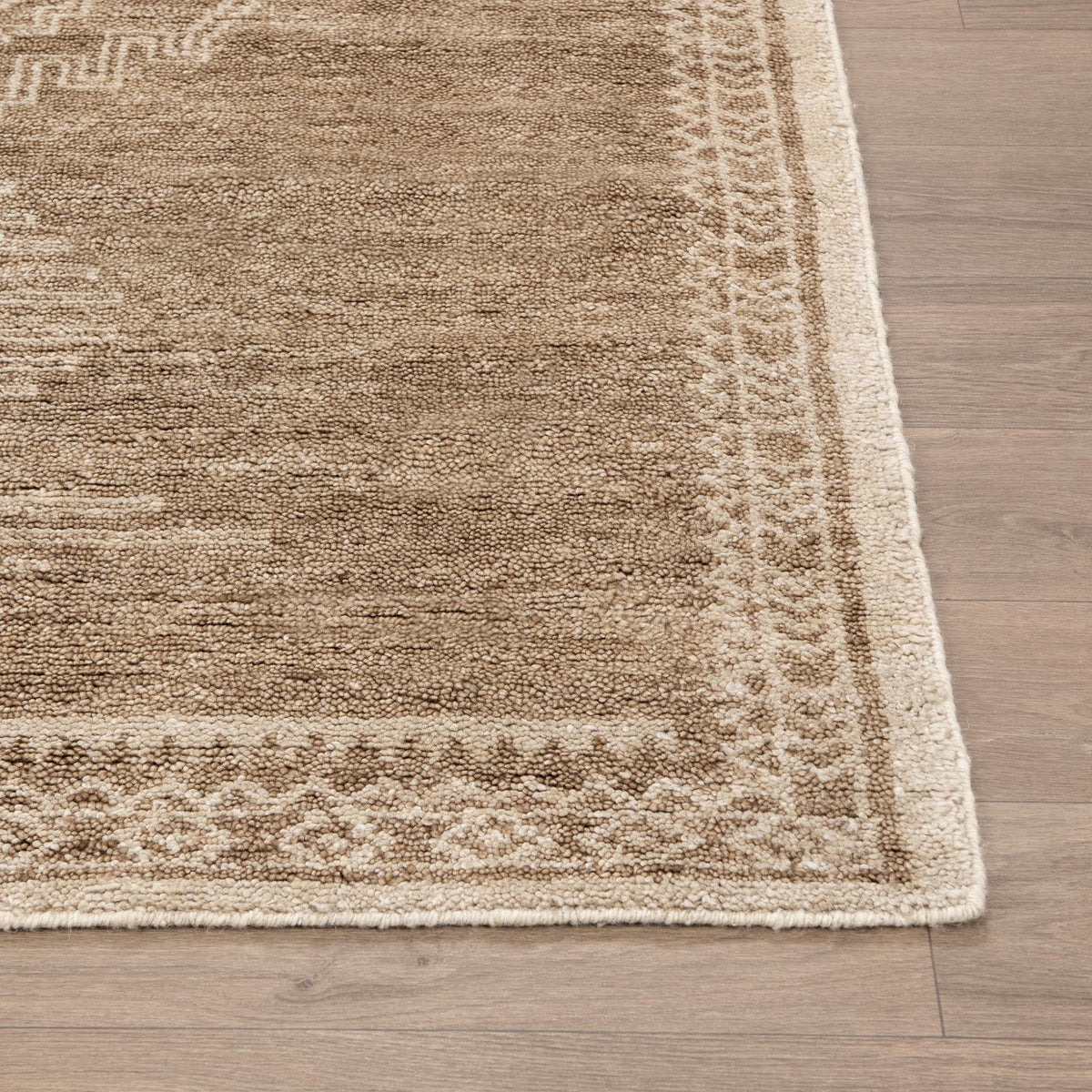 Hand-knotted Luxor Cairo area rug by Classic Home with intricate geometric patterns in warm earthy tones.